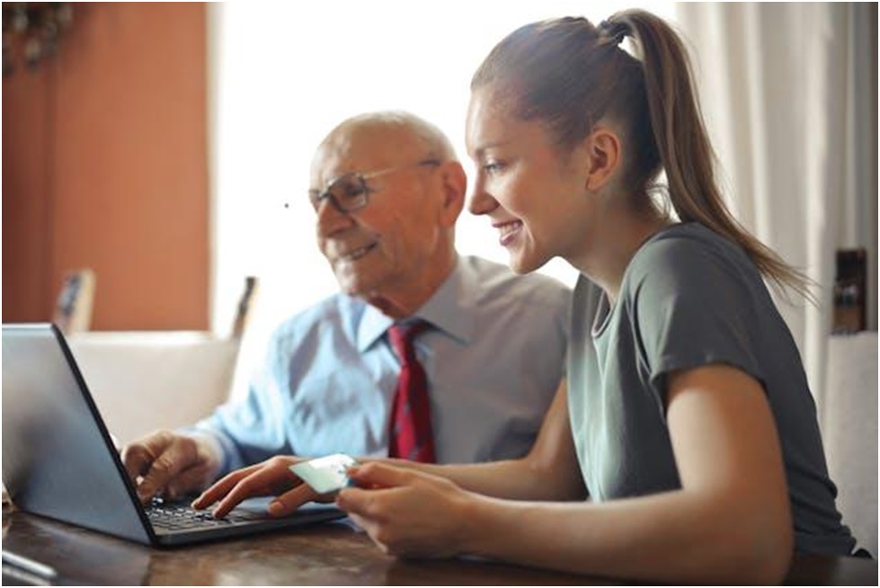 Two people making online rent payments